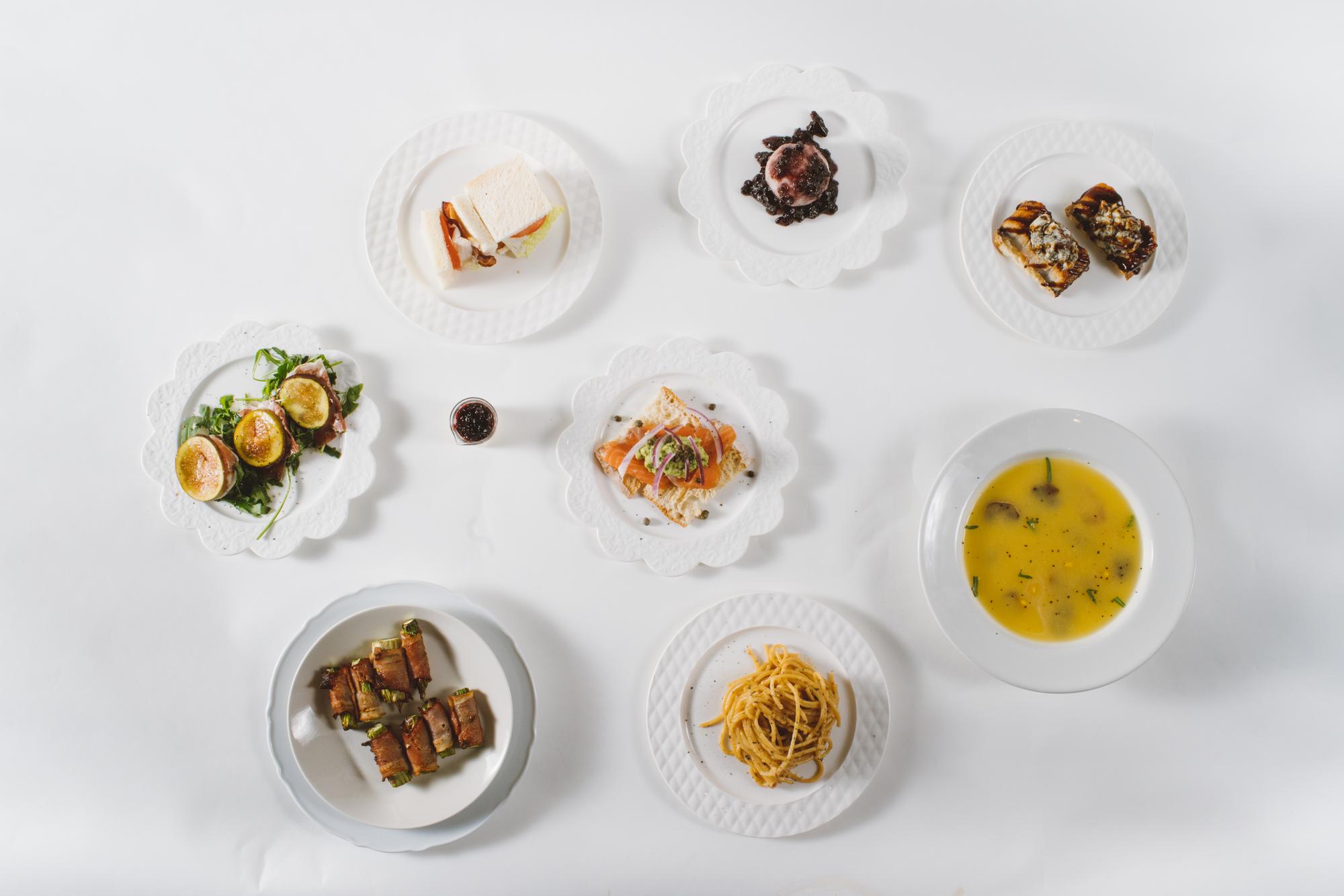 Assortment of prepared dishes on wooden table